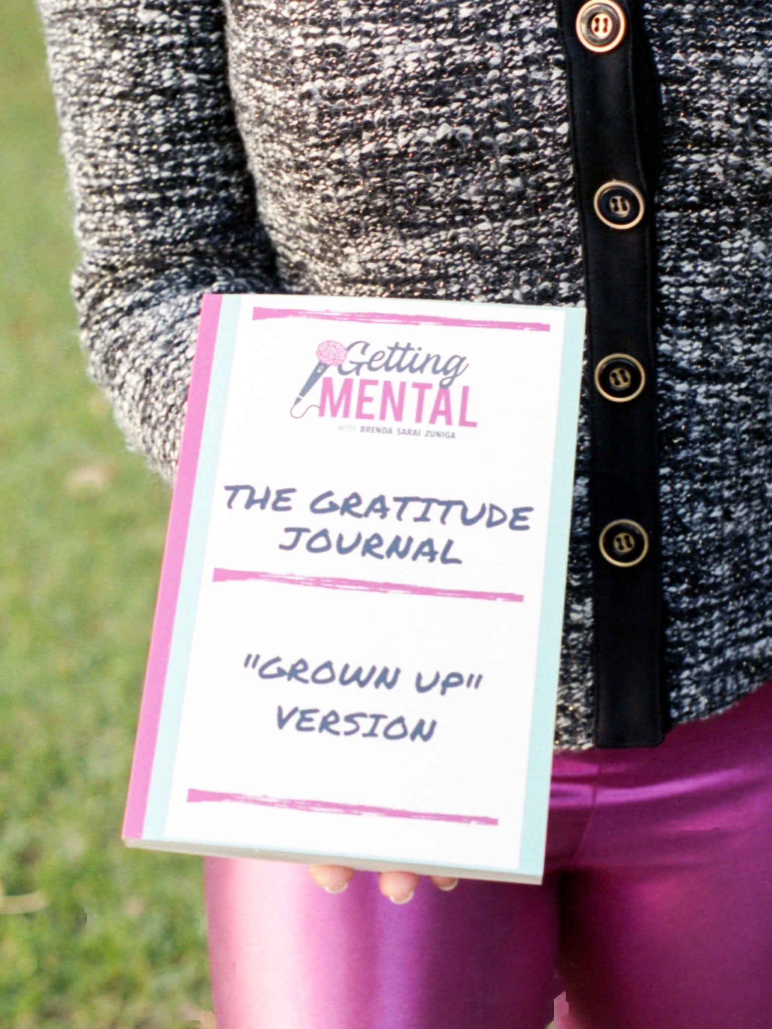 Brenda Sarai Zuniga holding her book, The Gratitude Journal