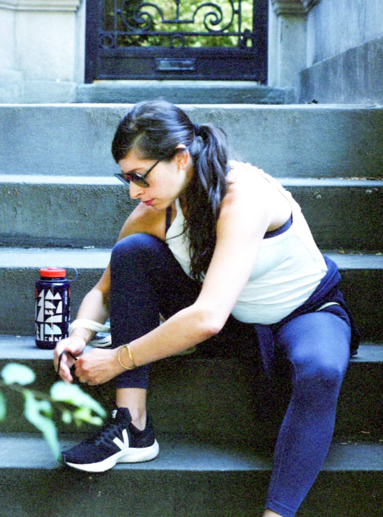 Erin Allweiss tying her shoes