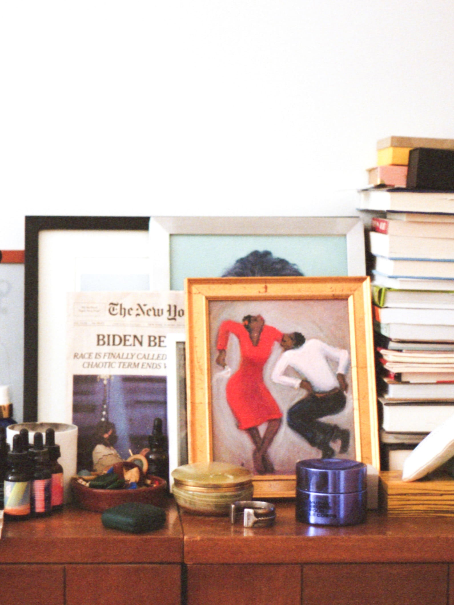 Erin Allweiss's bedside table, with products, art and books